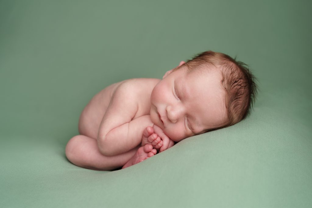 Stunning Newborn Photographs in the Dunmow and Bishop’s Stortford area - curled up