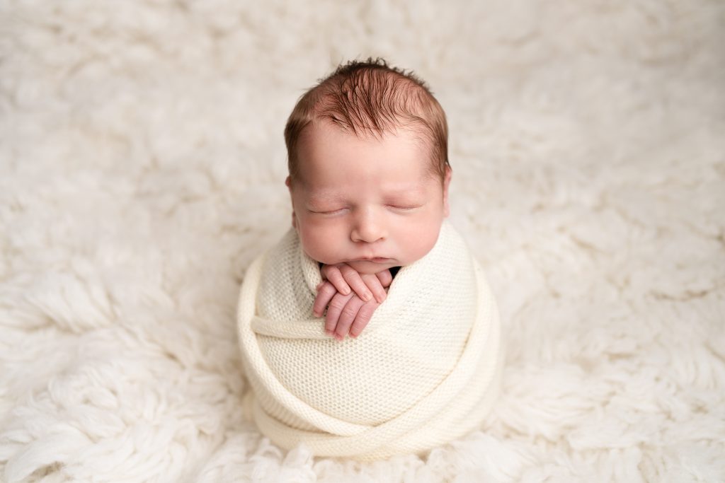 Stunning Newborn Photographs in the Dunmow and Bishop’s Stortford area - swaddled